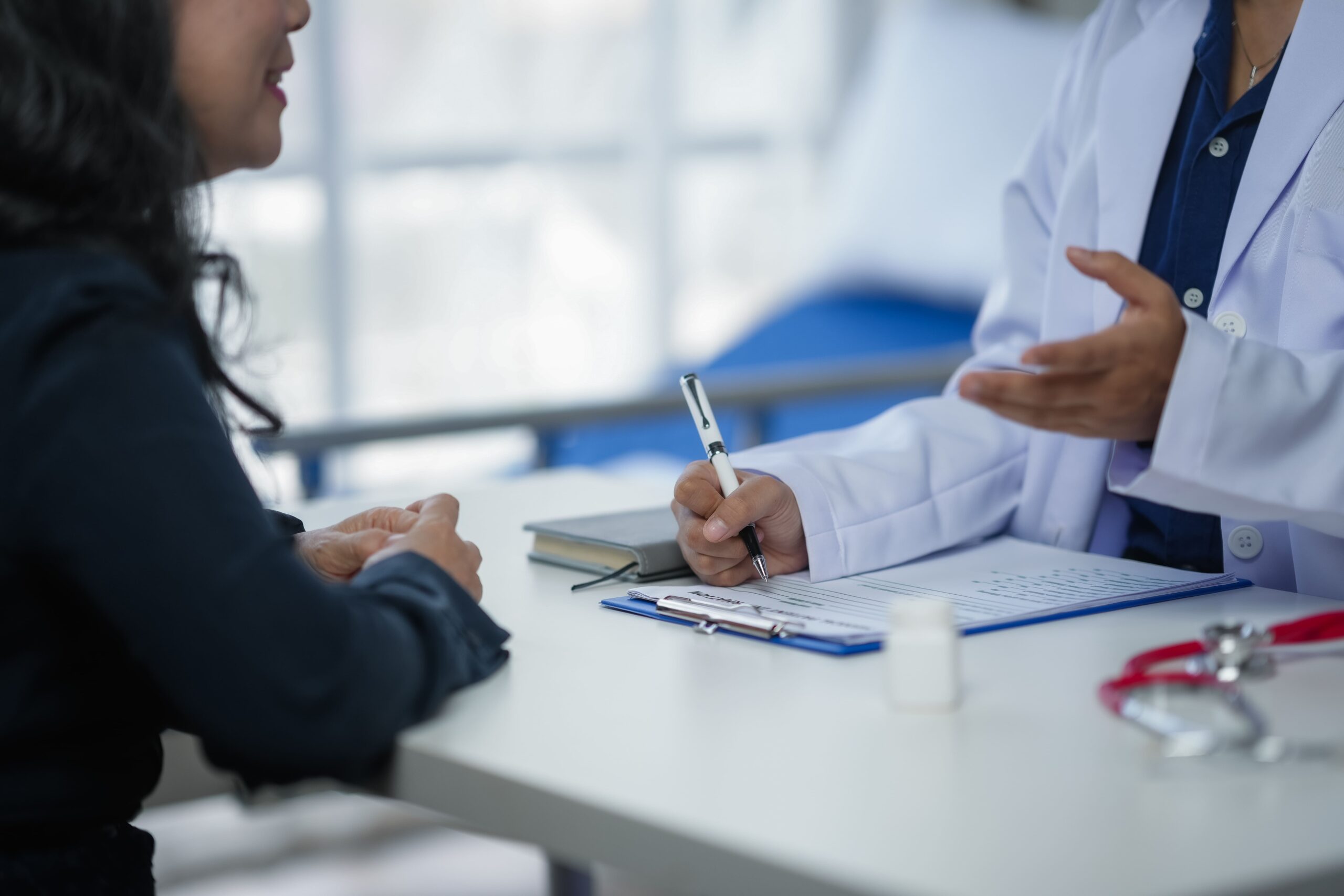 Image doctor consulting patient in a clinic discussing 2025 03 09 07 58 36 utc