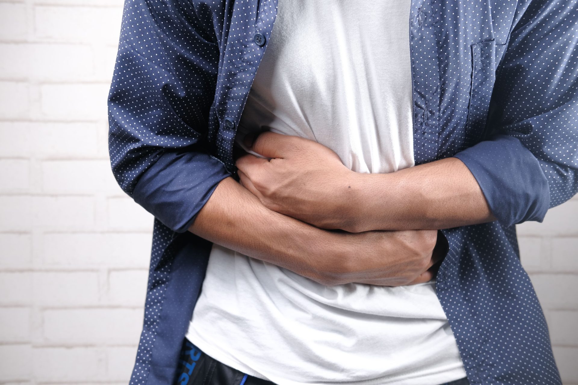 Image young man suffering stomach pain close up 2026 03 17 03 34 57 utc (1)